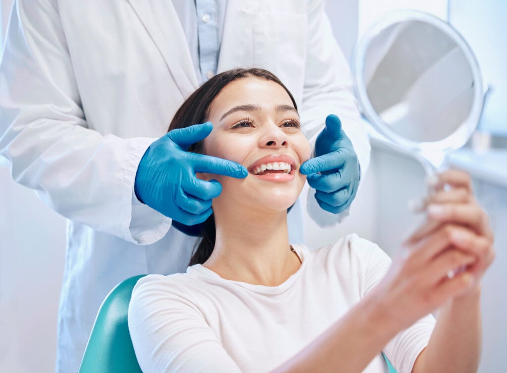 young woman getting her teeth cleaned