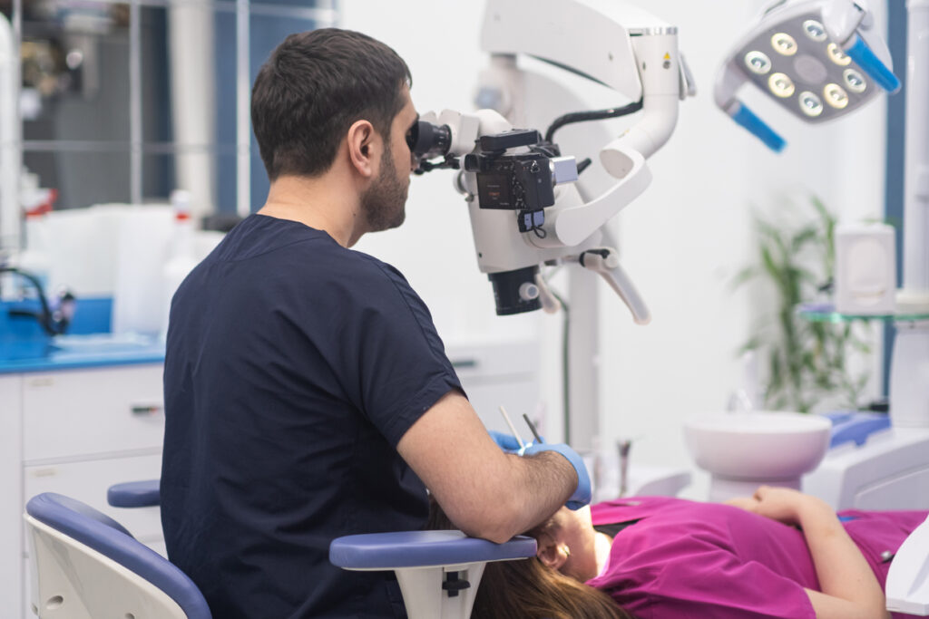 Innovative dental microscope for checkup of patient cavity dentist using equipment for woman teeth