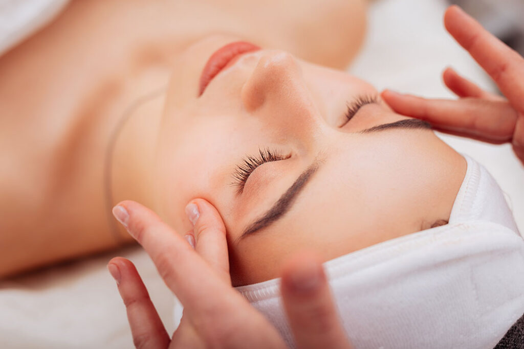 woman at a spa getting a facial treatment