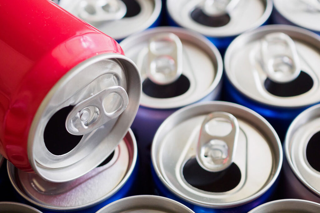 Empty aluminium drink cans recycling background concept