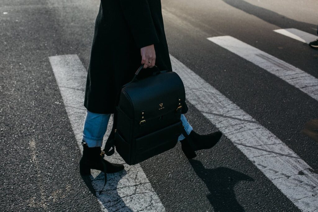 Photo by Vinta Supply Co. | NYC: https://www.pexels.com/photo/person-carrying-bag-walking-on-pedestrian-lane-842963/