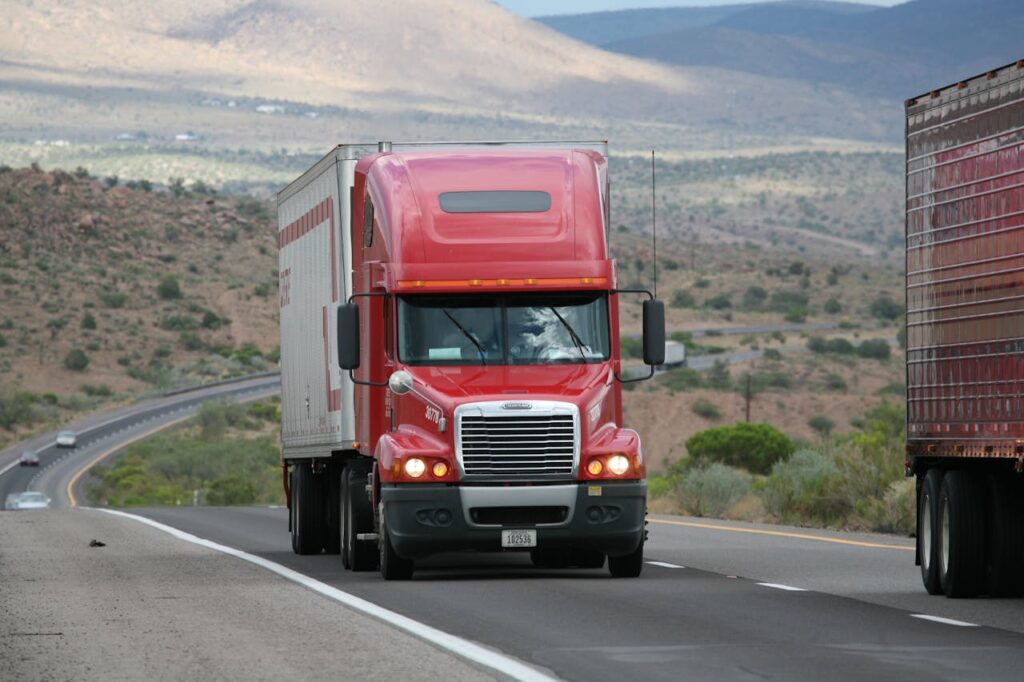 Photo by CARLOSCRUZ ARTEGRAFIA: https://www.pexels.com/photo/red-truck-on-the-road-11087837/