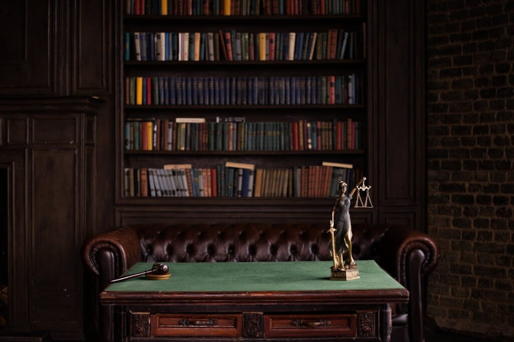 Photo by KATRIN BOLOVTSOVA: https://www.pexels.com/photo/justice-figurine-on-table-6077091/