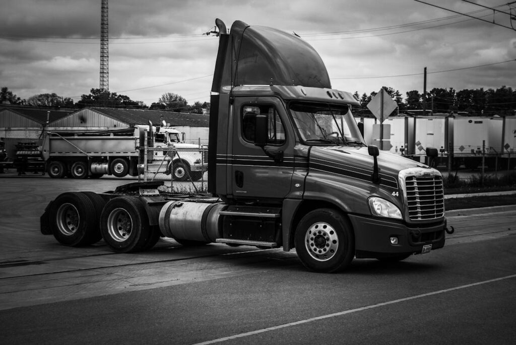 Photo by Jeffrey Robb: https://www.pexels.com/photo/grayscale-photo-of-semi-trailer-truck-on-the-road-12267889/
