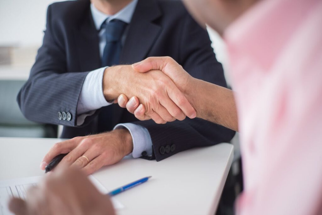 Photo by Kampus Production: https://www.pexels.com/photo/close-up-of-shaking-hands-between-men-8441790/