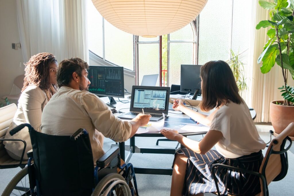 Photo by Kampus Production: https://www.pexels.com/photo/photograph-of-colleagues-talking-near-a-laptop-with-charts-6248980/